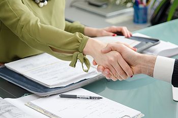 veterinary-handshake-paperwork-AdobeStock_79794626-body.jpg