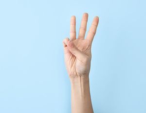 holding up three fingers