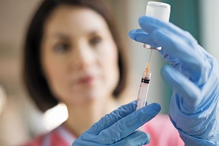 veterinary-Female-nurse-filling-syringe