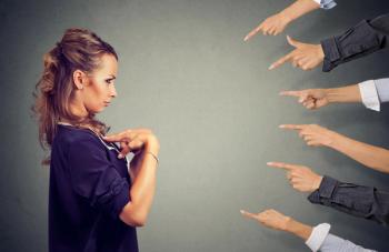 pointing fingers at woman