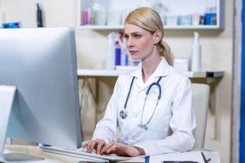 female veterinarian on computer