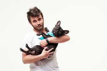 veterinarian holding dog