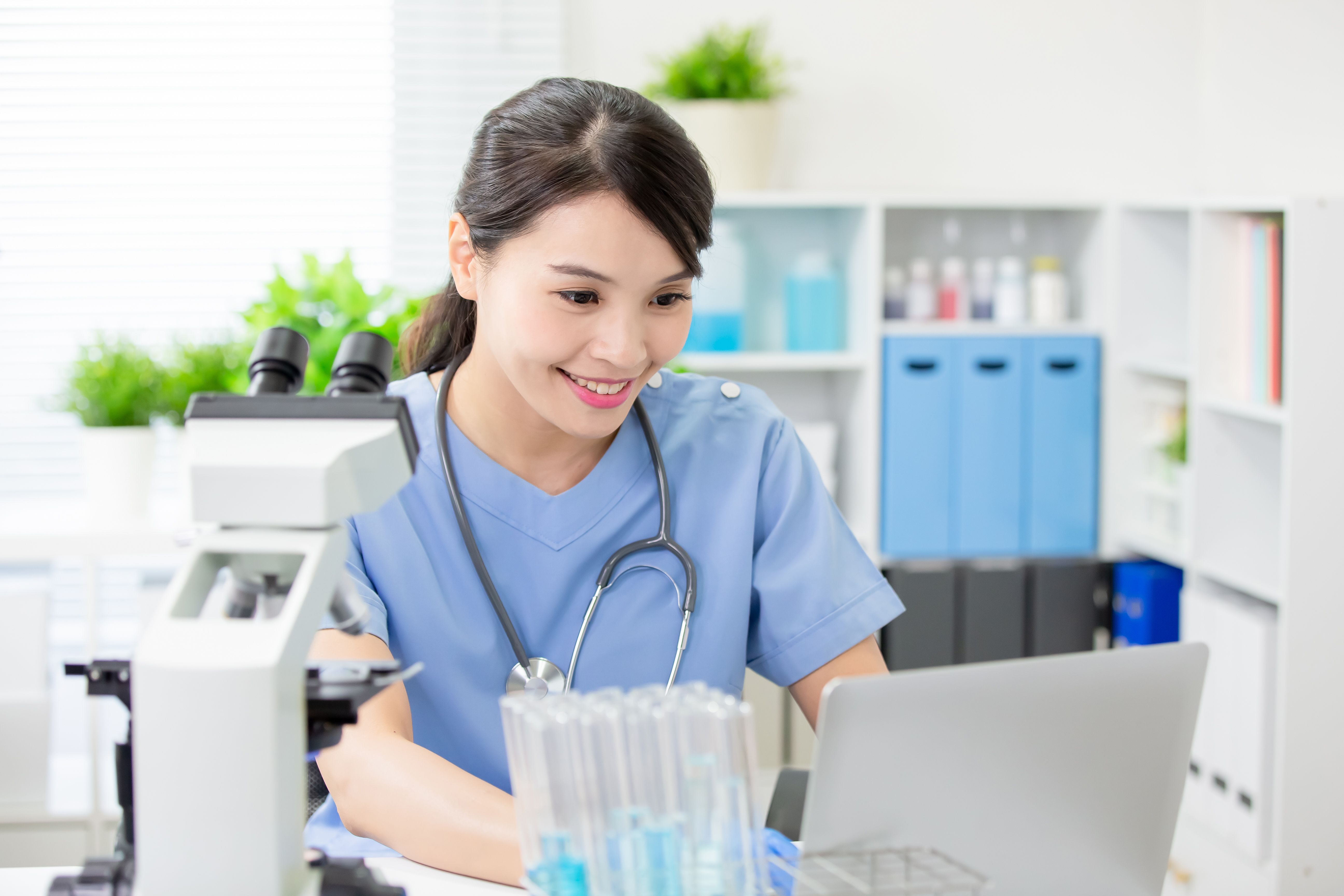 female veterinarian working on computer