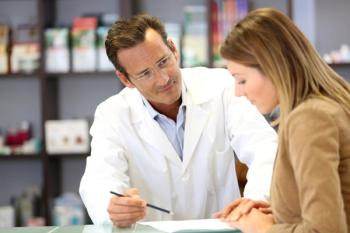 Pharmacist Advising Customer