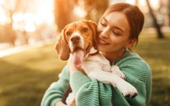 woman holding dog