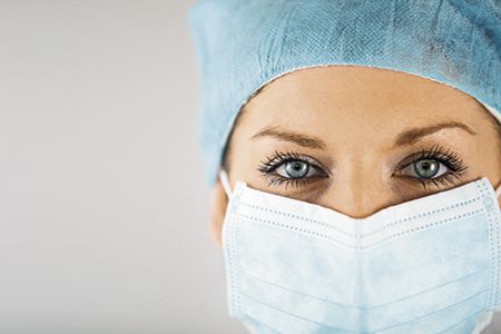veterinary-woman-wearing-surgical-mask-450px-shutterstock-114973210.jpg
