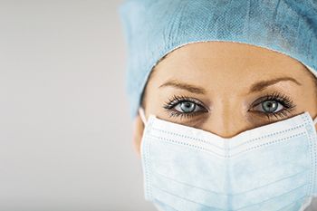 veterinary-woman-wearing-surgical-mask-450px-shutterstock-114973210.jpg