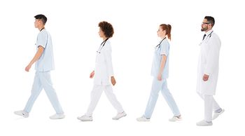 veterinary-team-walking-dvm-tech-AdobeStock_159797144_450.jpg