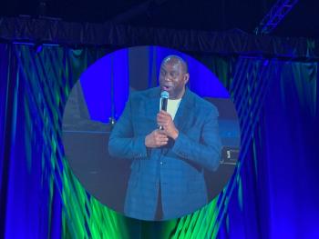 Magic Johnson addresses speaks at a veterinary conference
