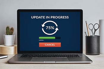 veterinary-computer-laptop-loading-upgrade-screen-AdobeStock_204334496-450.jpg