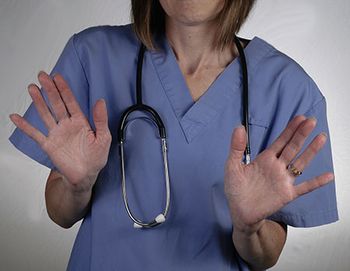 veterinary-nurse-or-doctor-says-no-hands-up-shutterstock_220659655-450.jpg
