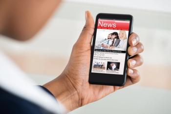 checking news on phone