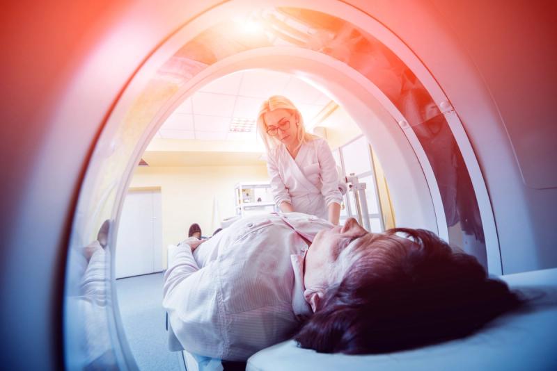 Doctor and patient in the room of computed tomography at hospital. Credit: Adobe Stock/romaset