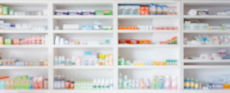 Stock photo of pharmacy shelves stocked with different medications. Credit: Adobe Stock/Kwangmoozaa