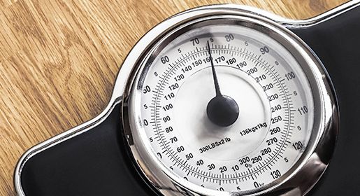 A large scale showing a patient's weight.