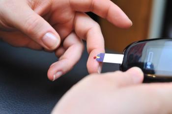 Patient performing a glucose check.