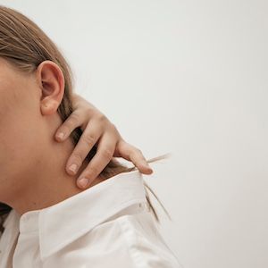 Rubbing neck | Image Credit: Teslariu Mihai/Unsplash