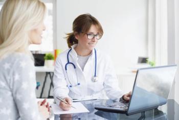 Doctor having a conversation with a patient.
