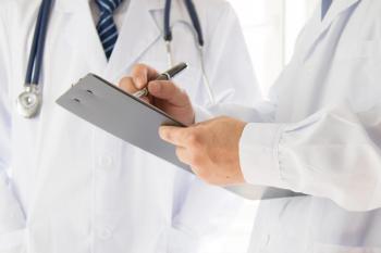 Doctors discussing a patient's prognosis. | Credit: Fotolia