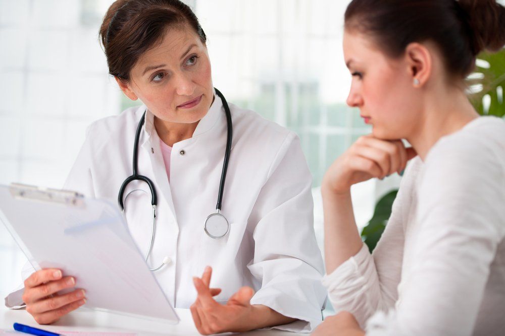 Female patient discussing iron deficiency with care provider. | Credit: Shutterstock