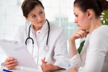 Female patient discussing iron deficiency with care provider. | Credit: Shutterstock