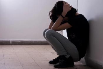 A woman dealing with stress during the COVID-19 pandemic