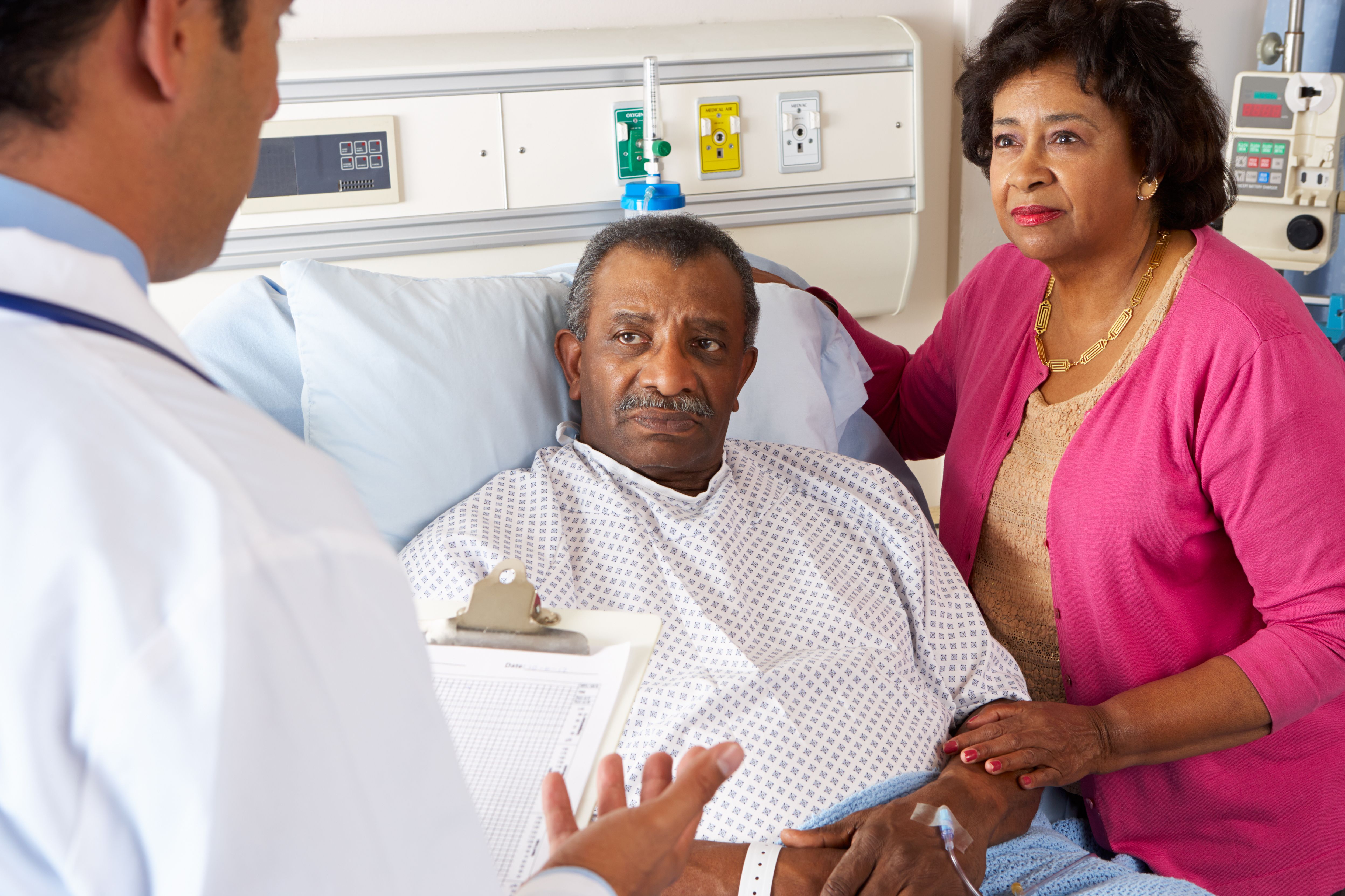 Doctor and African Caribbean patient in a hospital. 