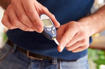 Man checking his blood sugar.
