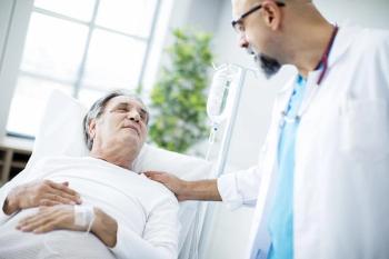 Doctor speaking with patient after bariatric surgery.