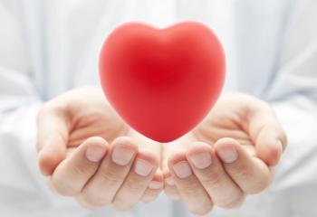 Heart floating above a pair of hands.