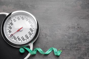 Stock imagery for obesity with an image of a scale with a measuring tape wrapped around it. | Credit: Adobe Stock