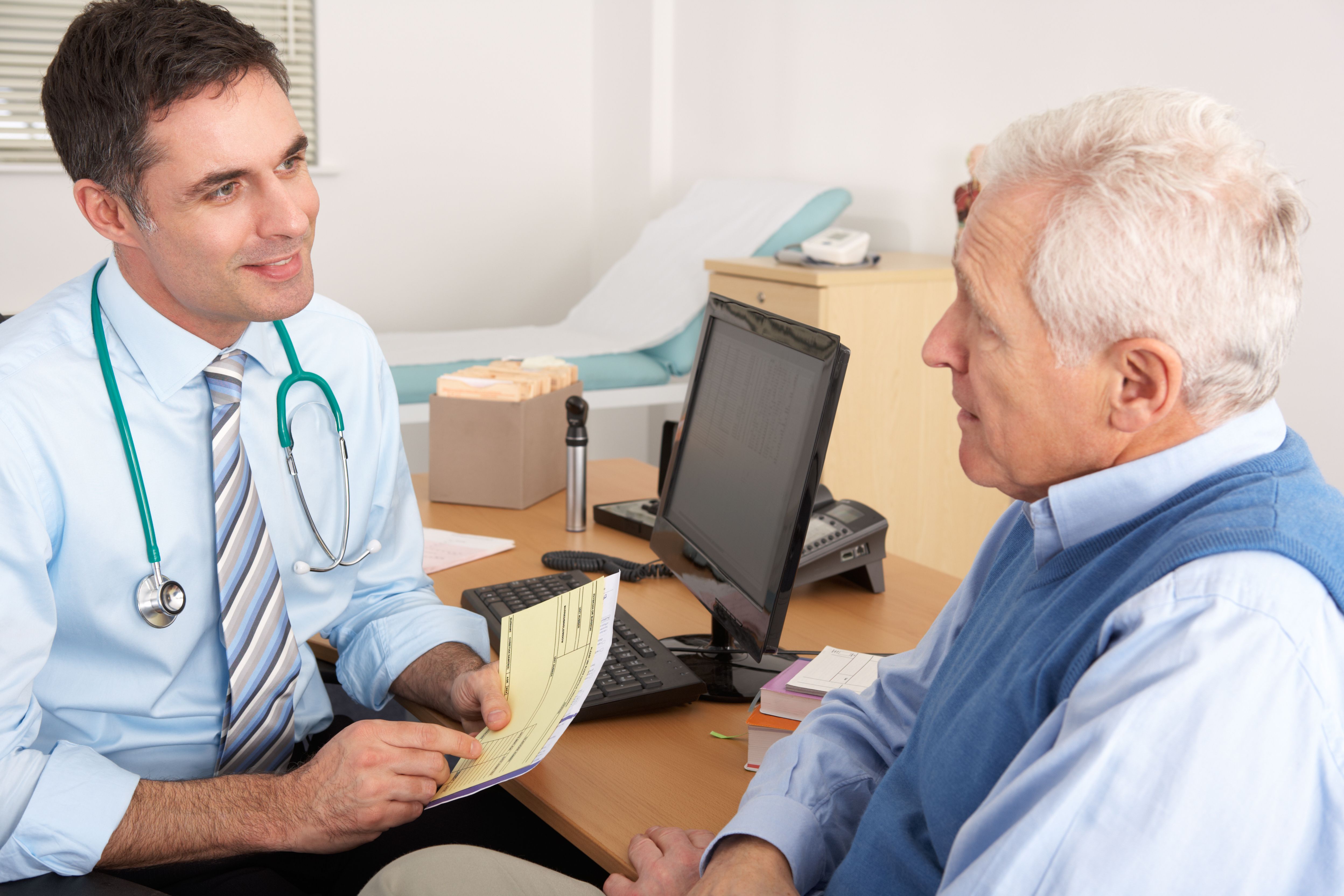 Doctor speaking with an older patient.