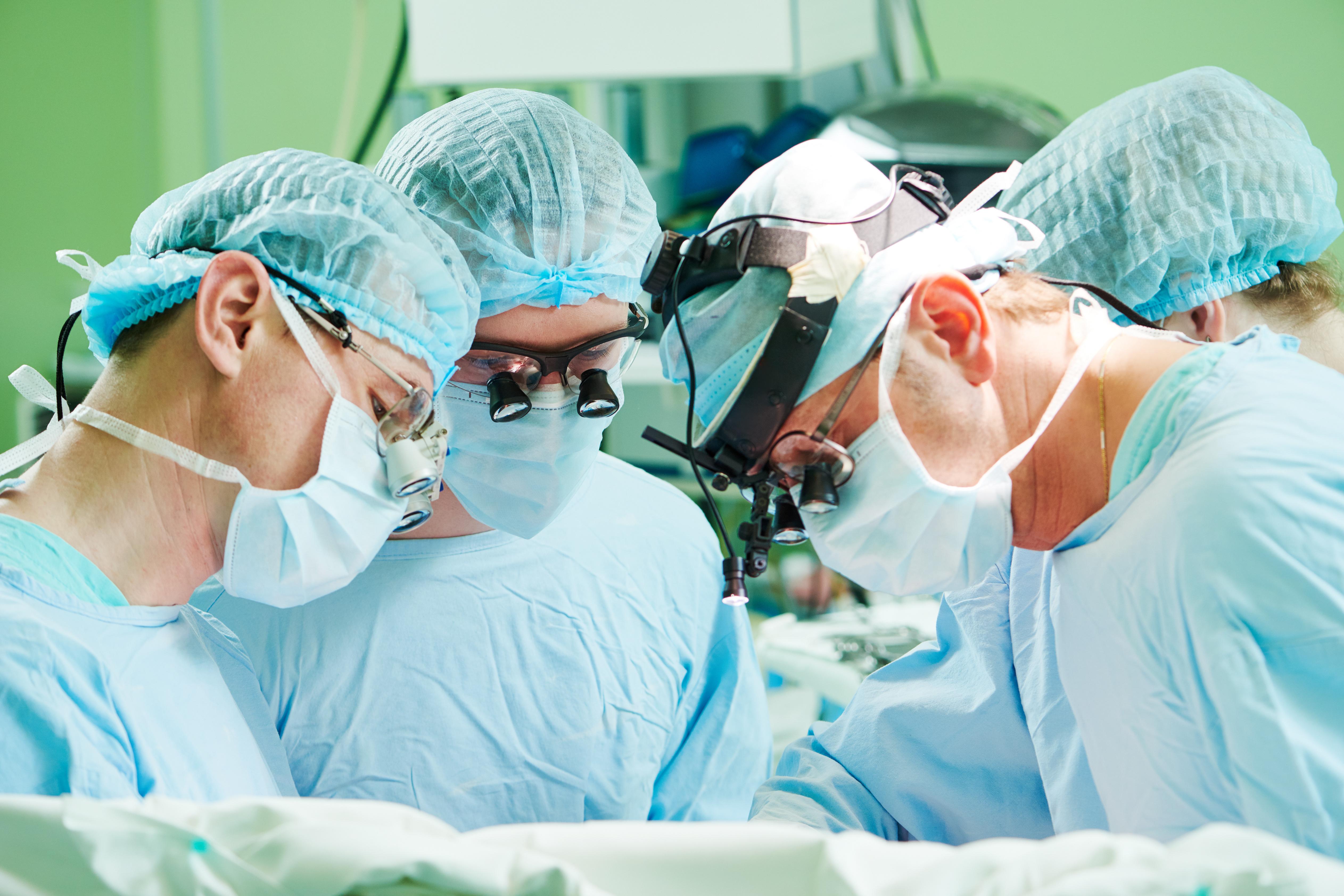 Doctors amputating a foot.