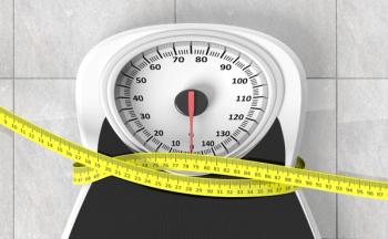 Measuring tape wrapped around a scale 
