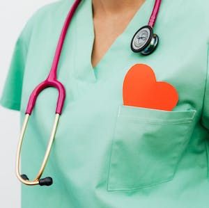 Stock photo showing a female clinician with a stethoscope