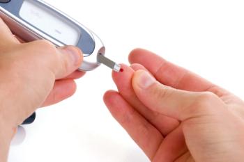 Person with diabetes checking their blood glucose levels.