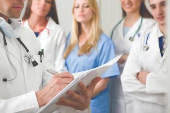 Group of doctors having a discussion about a patient's prognosis.