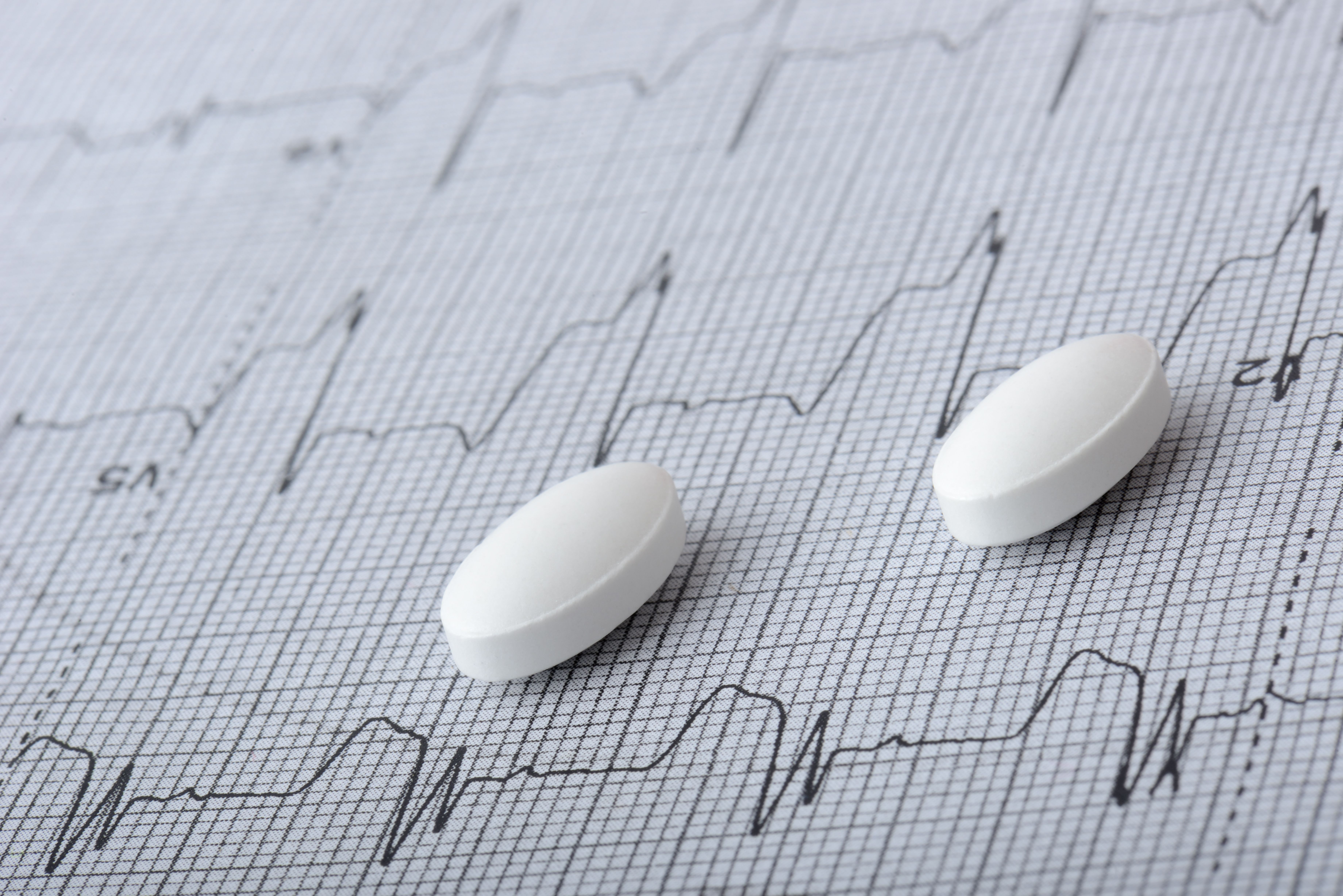 A close up of statins on top of an echocardiogram.