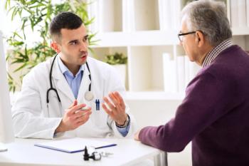Doctor and patient having a discussion during a visit.