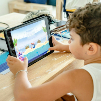 Child Playing Game on iPad | Credit: Pexels