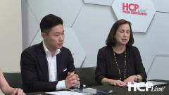 James Song, MD, and Adelaide Hebert, MD, sit at a table discussing seborrheic dermatitis.