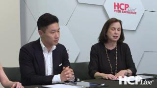 James Song, MD, and Adelaide Hebert, MD, sit at a table discussing seborrheic dermatitis.