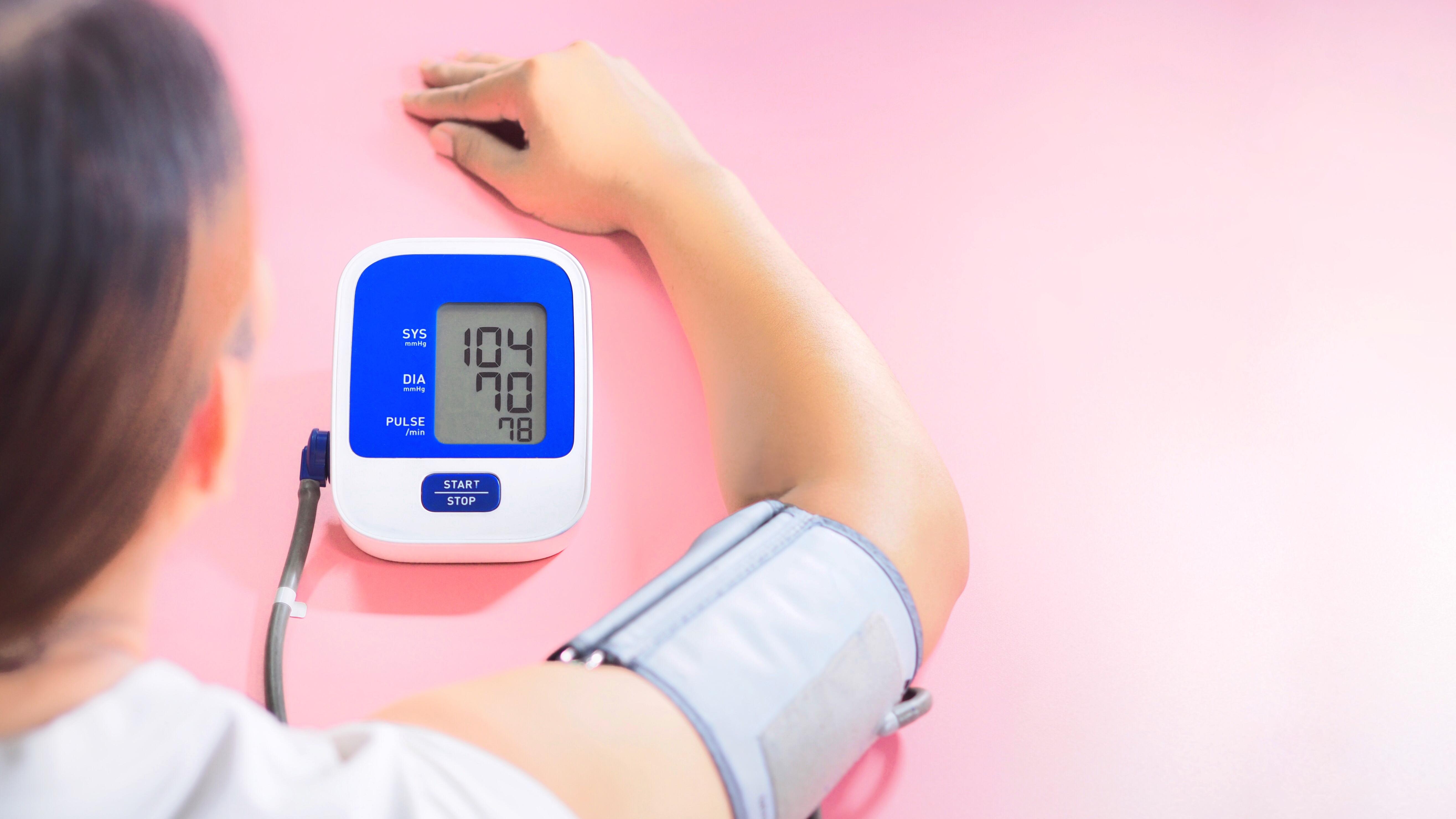 Patient measuring their blood pressure.