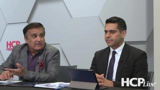 Neal Bhatia, MD, and Shawn Kwatra, MD, sit at a table discussing seborrheic dermatitis.