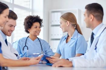 Doctors talking amongst one another.
