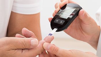Person undergoing a blood sugar check