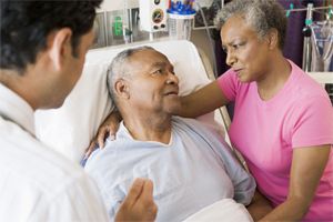 Stock imagery depicting a non-Hispanic Black patient receiving care in a hospital. 