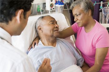 Stock imagery depicting a non-Hispanic Black patient receiving care in a hospital.