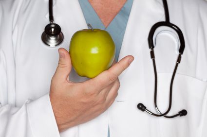 Stock art of a healthcare provider holding an apple