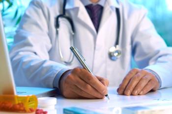 Doctor filling out a prescription